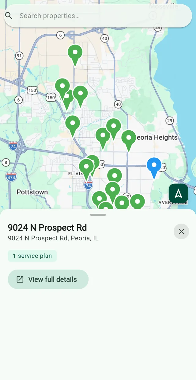 The property map: a pin on each property across Peoria, one of them tapped.